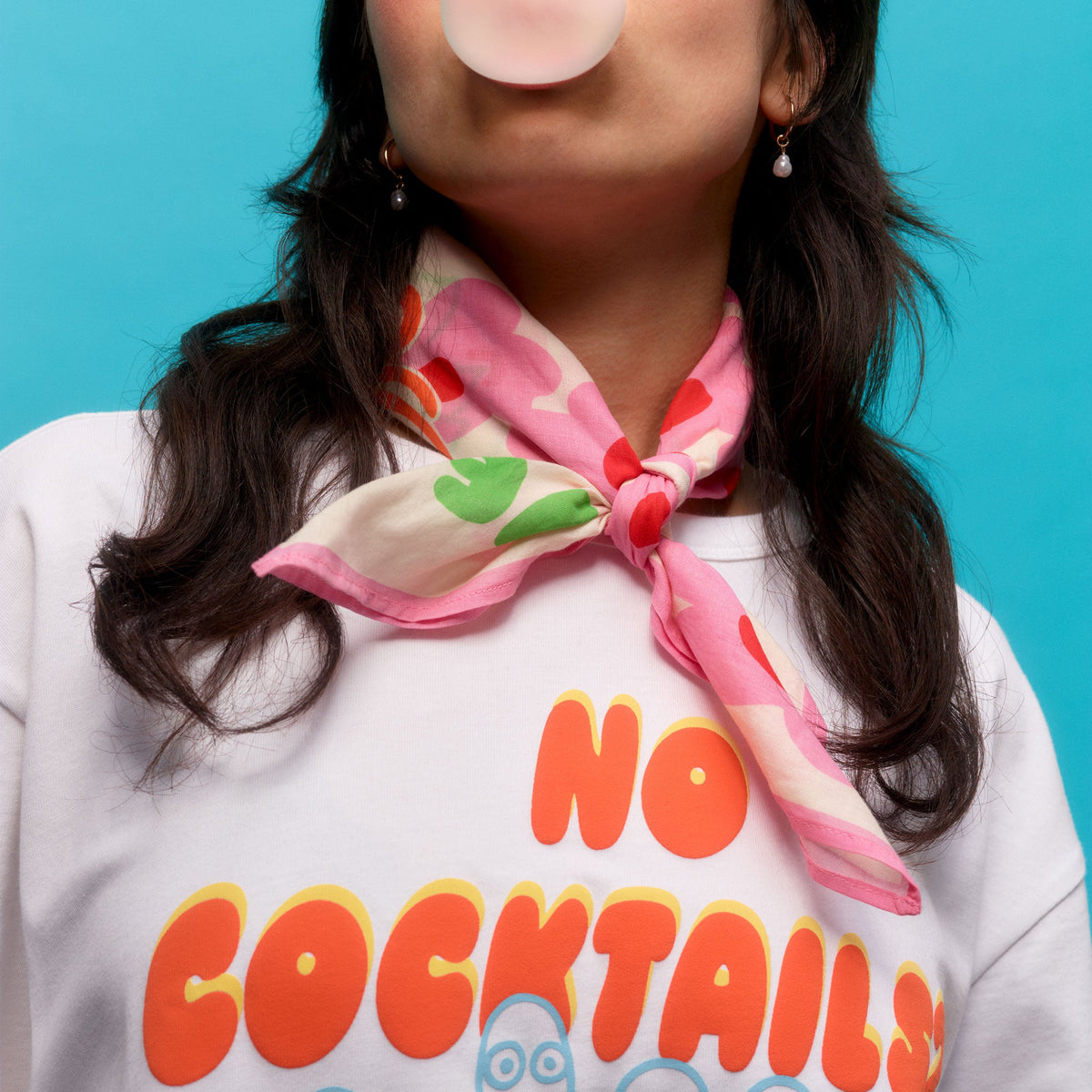 Person wearing a Rebel Club scarf and on a blue background