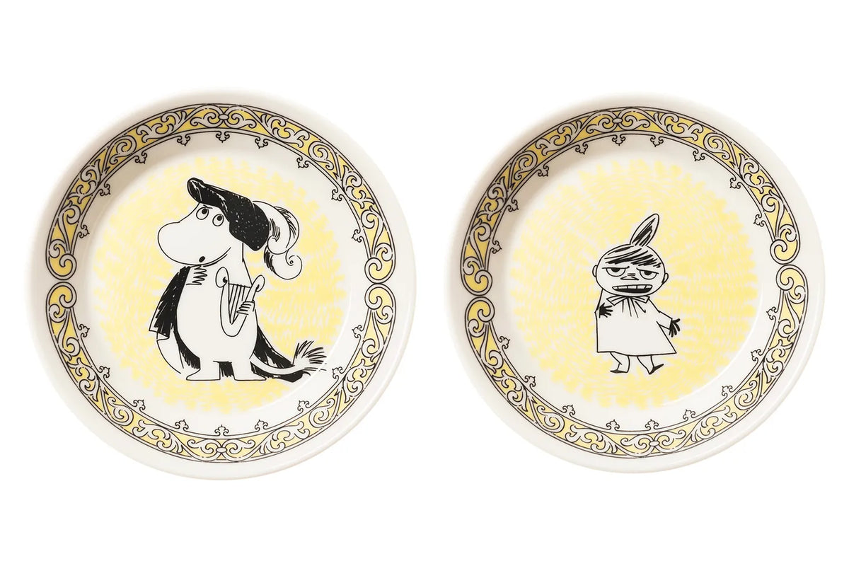 Two Moomin Arabia Scope Opera plates with Moomintroll and Little My characters on a white and yellow decorative background