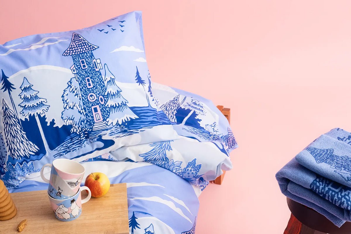 Home at last -collection bed linen and towels against a pink background